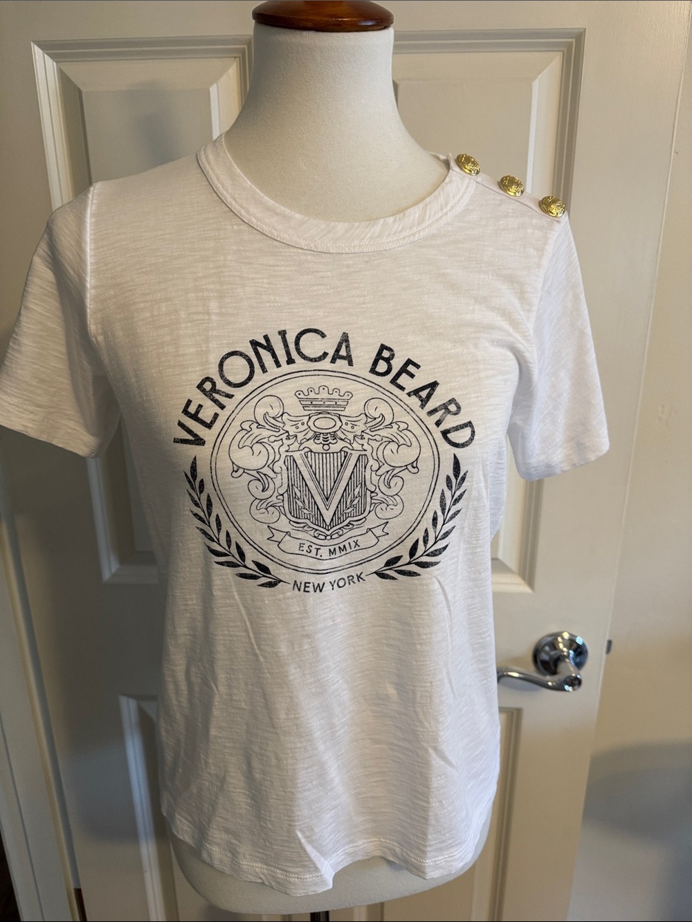 Veronica Beard White Crest Logo Short Sleeve Tee with Gold Shoulder Buttons